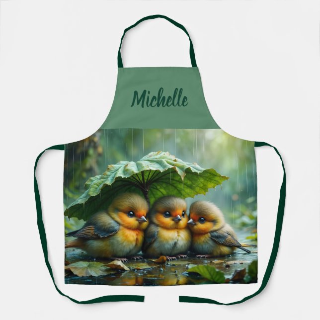 Cute fluffy birds hiding under leaf in rain apron (Front)
