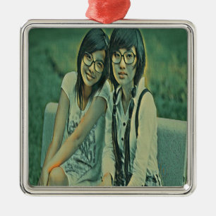 Cute friends sitting next to each other metal ornament