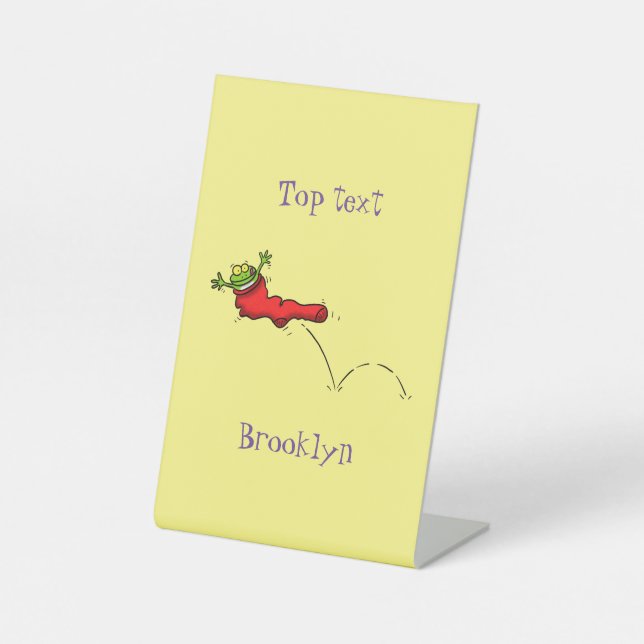 Cute frog in a red sock jumping cartoon pedestal sign (Front)