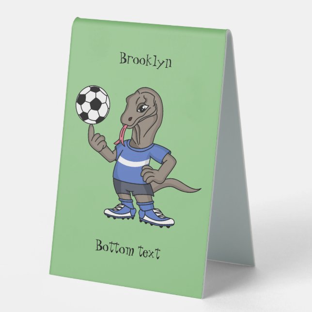 Cute funny Komodo dragon playing soccer cartoon (Front)