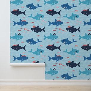 Cute funny sharks with pirate hats on blue wallpaper