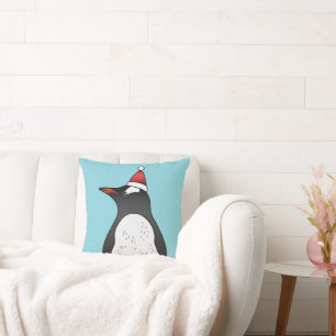 Cute Gentoo Penguin Wearing A Santa Hat On Blue Cushion