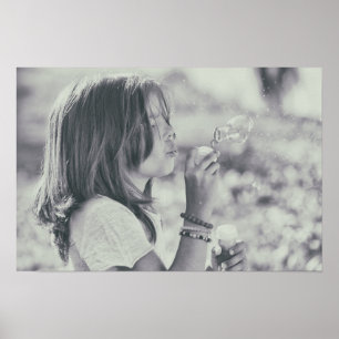Cute Girl playing with bubbles poster