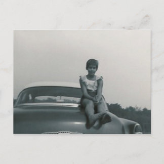 cute girl sitting on back of old car post card