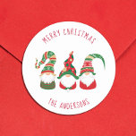Cute Gnomes Merry Christmas Classic Round Sticker<br><div class="desc">Simple and cute nordic-style holiday sticker featuring three cute Scandinavian Christmas gnomes with seasonal red and green hats and tunics. You can personalise a "Happy Holidays,  "Merry Christmas, " etc.,  greeting and your name in fun typography.</div>