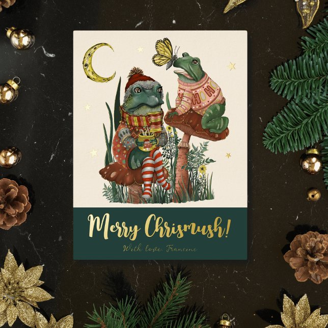 Cute Green Mushroom Frog and Toad Merry Christmas  Foil Holiday Postcard (Whimsical Merry Christmas card with an illustration of frogs sitting on mushrooms drinking cocoa)