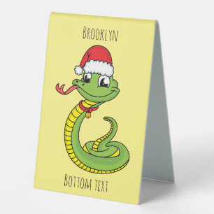 Cute green snake with santa hat cartoon