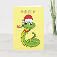 Cute green snake with santa hat cartoon