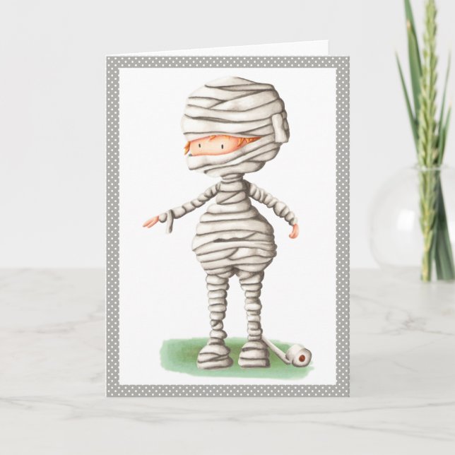 Cute Halloween card with a boy in a mummy costume (Front)