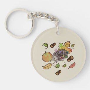 Cute hand drawn hedgehog in fall with leaves key ring