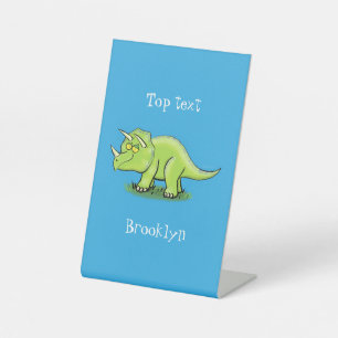 Cute happy green triceratops dinosaur cartoon pedestal sign