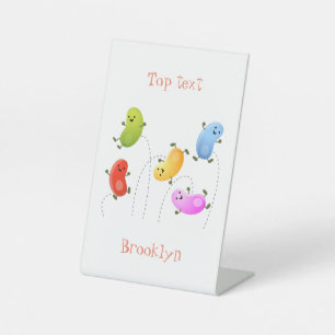 Cute happy jellybeans jumping cartoon illustration pedestal sign
