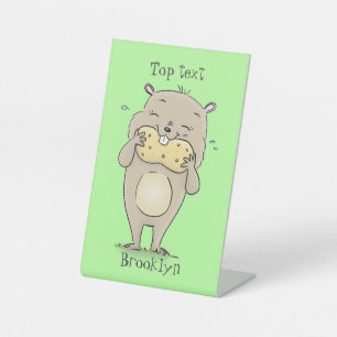 Cute happy smiling hamster with peanut cartoon pedestal sign