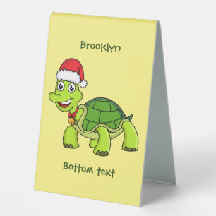 Cute happy tortoise wearing Santa hat