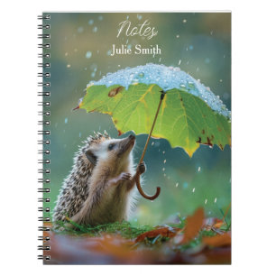 Cute hedgehog holding a leaf umbrella notebook