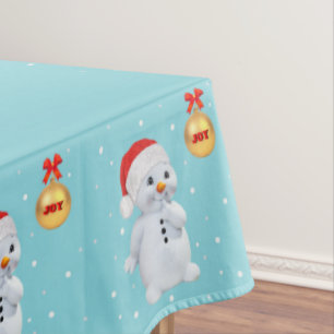 Cute Holiday Snowman and Golden Ball on Light Teal Tablecloth