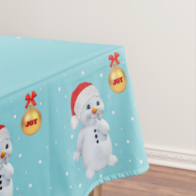Cute Holiday Snowman and Golden Ball on Light Teal Tablecloth (In Situ)