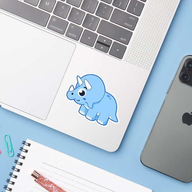 Cute Illustration Of A Triceratops Dinosaur. (Laptop w/ iPhone)