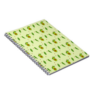 Cute kawaii avocado on green notebook