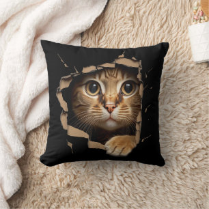 Cute kitten looks from torn fabric Cats Cushion