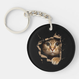 Cute kitten looks from torn fabric Cats Key Ring