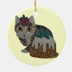 cute kitten tabby cat eating pudding at christmas ceramic tree decoration