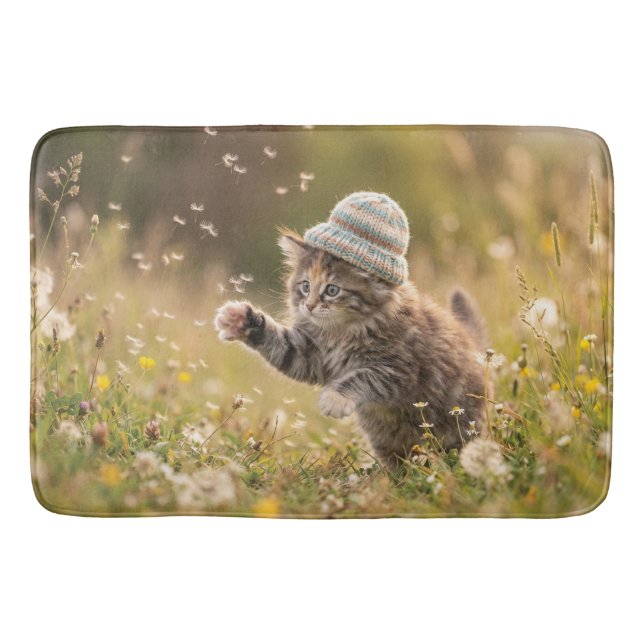 Cute Kitten Wearing a Hat Playing with Dandelions Bath Mat (Front)