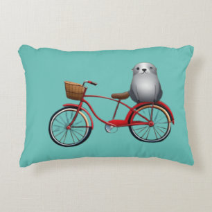 Cute little cartoon seal on a bicycle decorative cushion