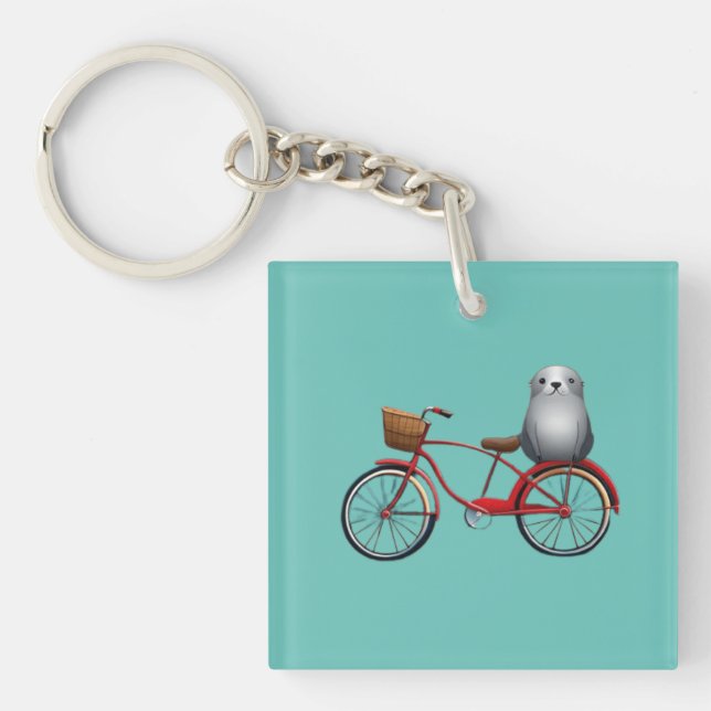 Cute little cartoon seal on a bicycle key ring (Front)