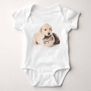 cute little cat sleeps in dog's hands baby bodysuit