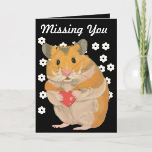 Cute little Hamster holding a heart “Missing You” Card