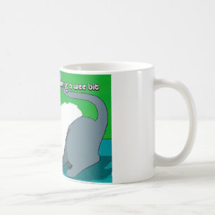 Cute mug with Kitty hiding under Santa's hat.