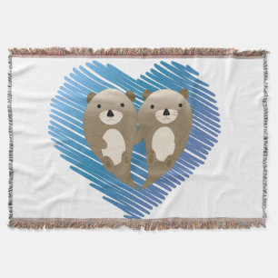 Cute Otters with Blue Heart in the Background Throw Blanket