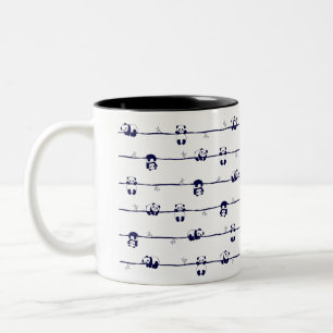 Cute Panda hanging on branches Two-Tone Coffee Mug