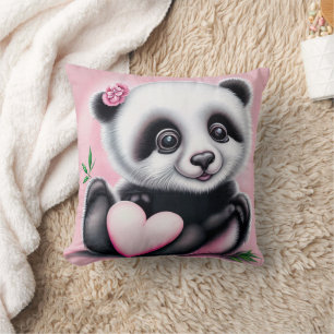 Cute panda holding a heart cushion