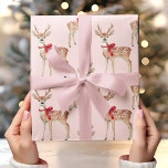 Cute Pastel Pink with Deer and Red Bow  Wrapping Paper<br><div class="desc">Wrap your gifts with a charming holiday touch using this Pastel Pink Background with Deer and Red Bow wrapping paper. Featuring delicate deer adorned with festive red bows set against a soft pastel pink backdrop, this design brings a blend of elegance and whimsy to your Christmas gift wrapping. Perfect for...</div>
