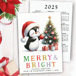Cute Penguin Christmas Colourful Merry and Bright Holiday Card<br><div class="desc">Create stylish personalised non-photo Christmas cards with a cute penguin in a red Santa hat near a Christmas tree. The cheerful penguin and a Merry & Bright saying in colourful letters are on the front side. On the backside, there is a full year at a glance Sunday through Saturday 2025...</div>