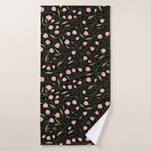 Cute, pink flower on black with repeating pattern bath towel