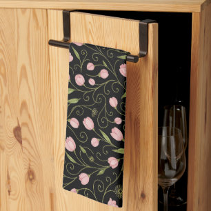 Cute, pink flower on black with repeating pattern tea towel