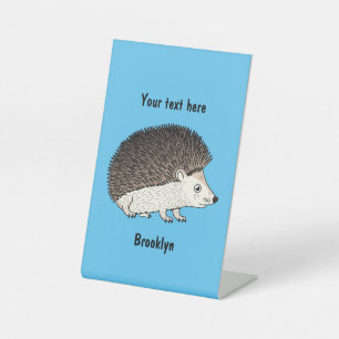 Cute prickly hedgehog cartoon illustration pedestal sign
