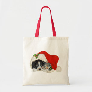 Cute Puppy And Kitten Sleep In A Santa Hat Tote Bag