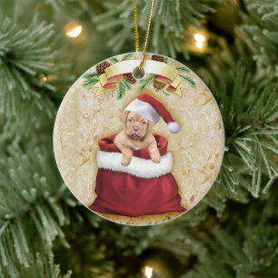 Cute Puppy in a bag with Christmas toys Ceramic Ornament
