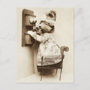 Cute puppy in a dress talking on the phone postcard