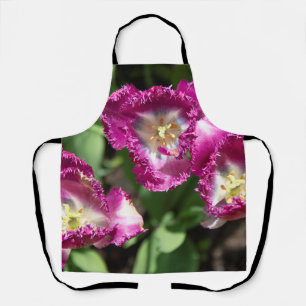 Cute purple tulips in the garden apron