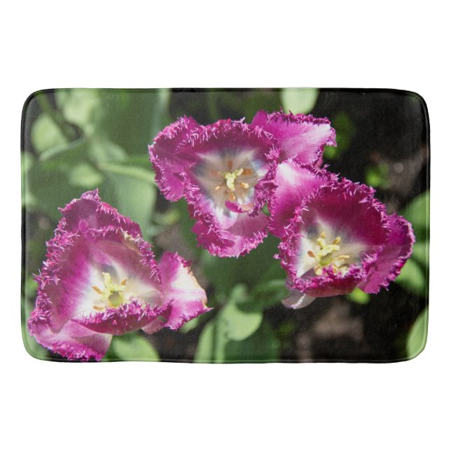 Cute purple  tulips  in the garden  bath mat (Front)