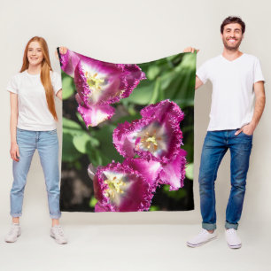 Cute purple tulips in the garden fleece blanket