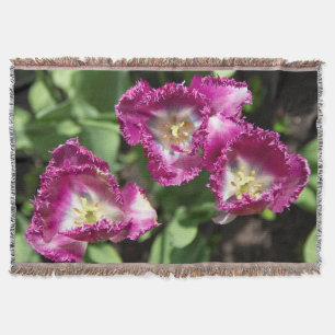 Cute purple  tulips  in the garden throw blanket