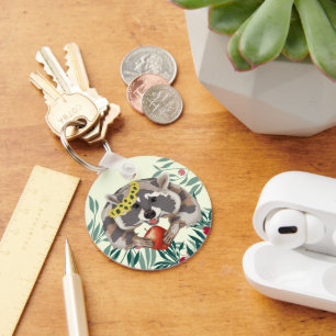 Cute racoon with an apple in the paws key ring