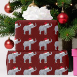 Cute Red Christmas Elephant in Santa Hat Wrapping Paper<br><div class="desc">Cute elephant Christmas wrapping paper featuring a beautiful grey elephant wearing a red santa hat on a burgundy background for Xmas. I love funny holiday animals.</div>