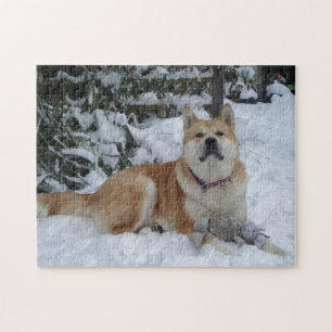 Cute red japanese akita in snow with grey mouse jigsaw puzzle